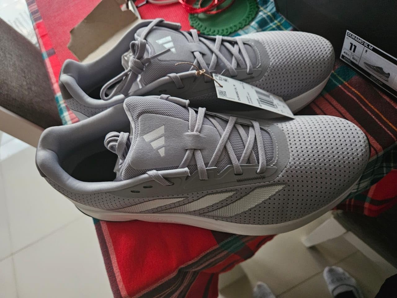Adidas Duramo SL from multiple angles showing design details and construction quality