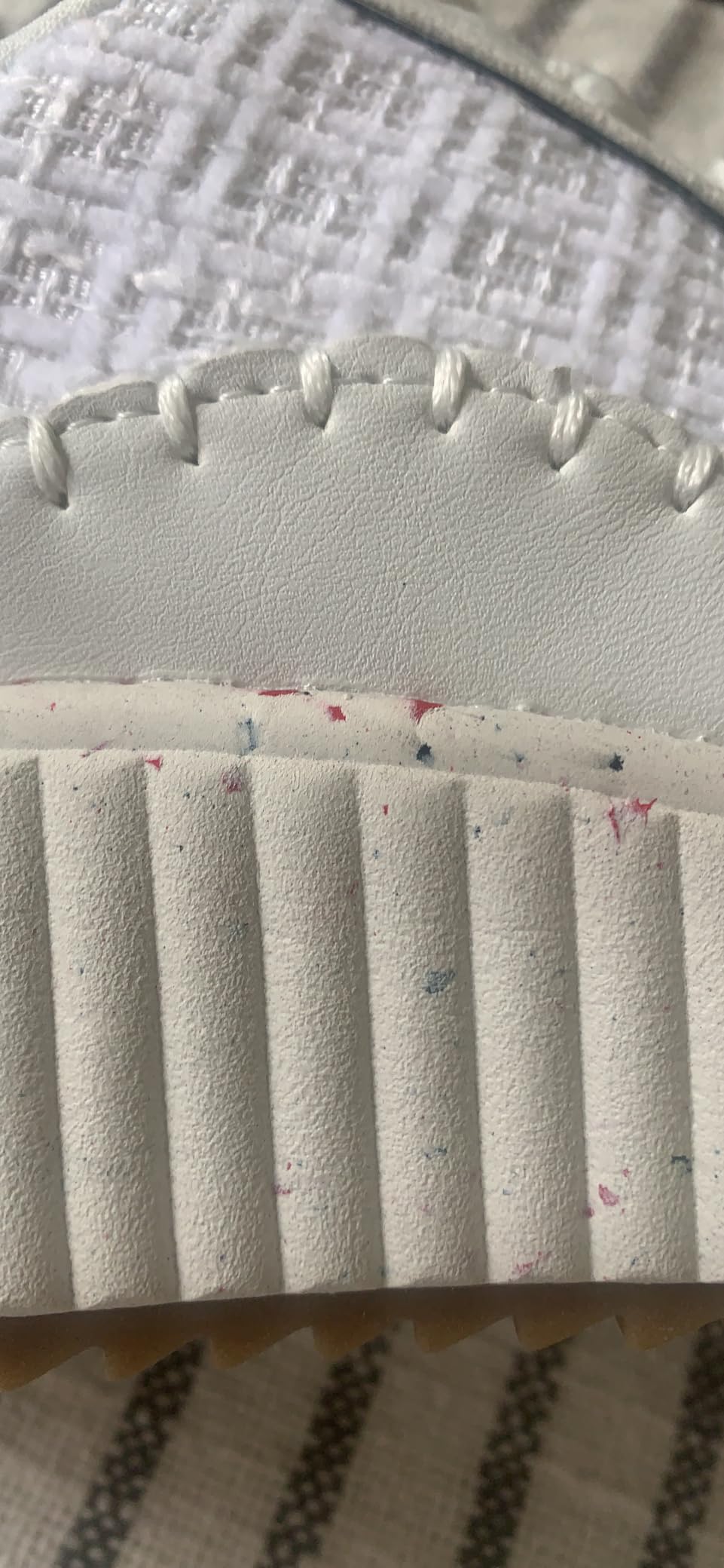 Bright white fabric vs off-white faux leather—two-tone white callout