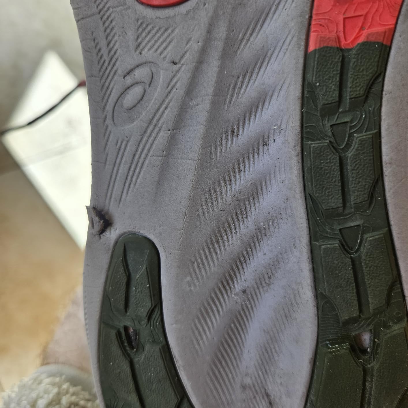 ASICS Gel-Nimbus 26 outsole wear pattern showing sole durability after extended testing