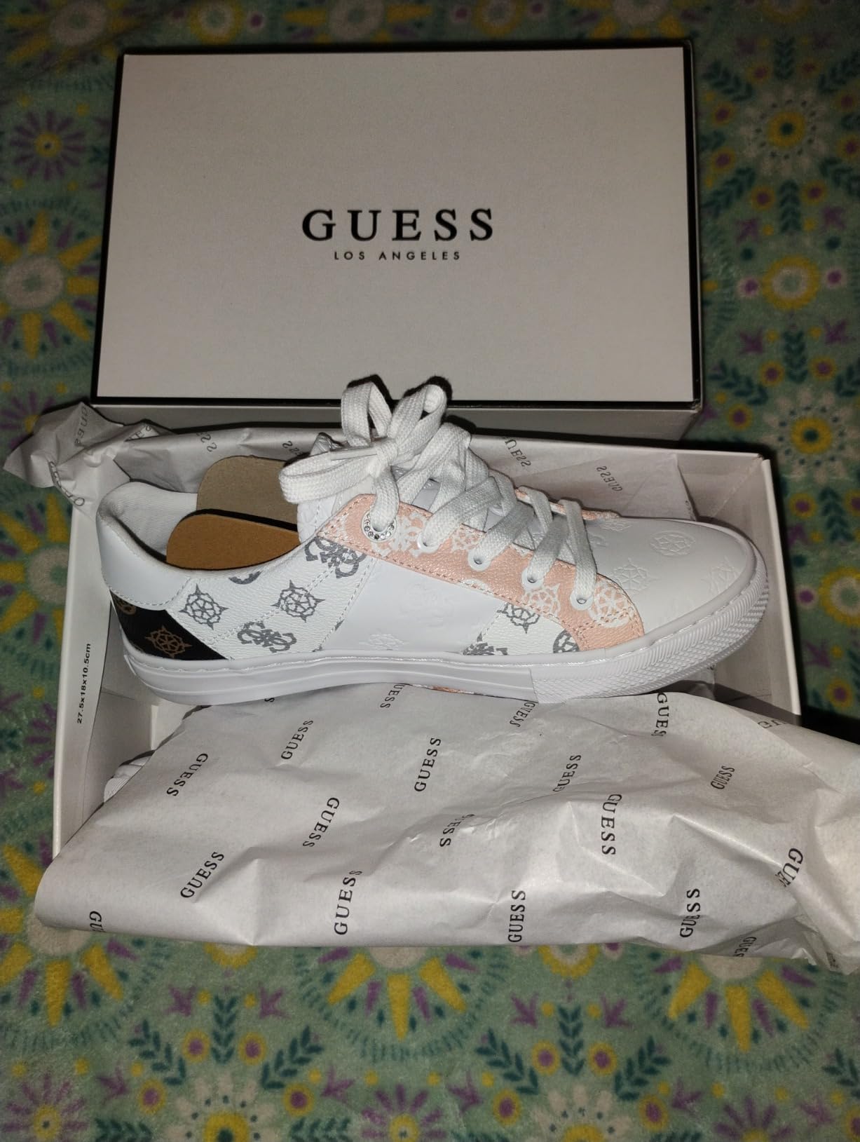 GUESS Women's Loven Sneaker showing multiple colorway options for style comparison