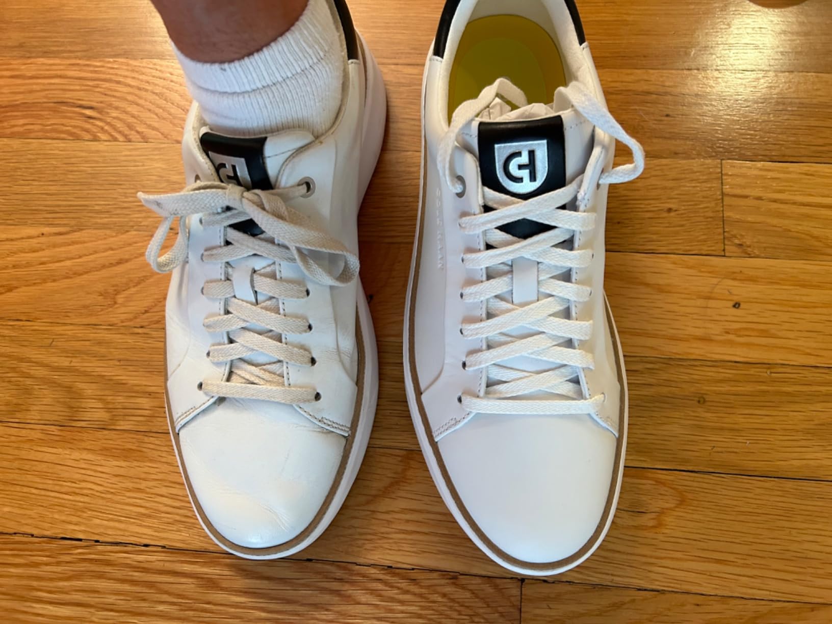 Final product shot of Cole Haan Grandpro Topspin showcasing premium white leather construction and refined design