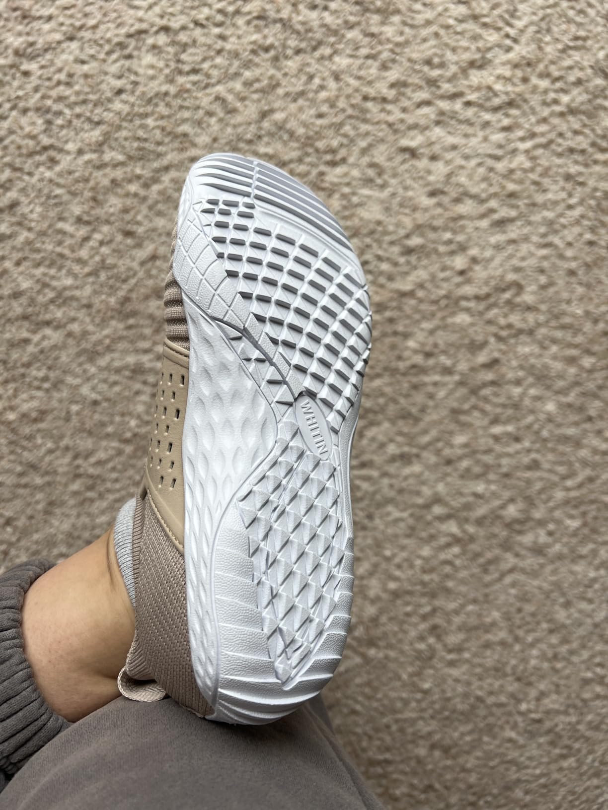 WHITIN barefoot shoes in outdoor setting showing natural flex and ground contact during movement