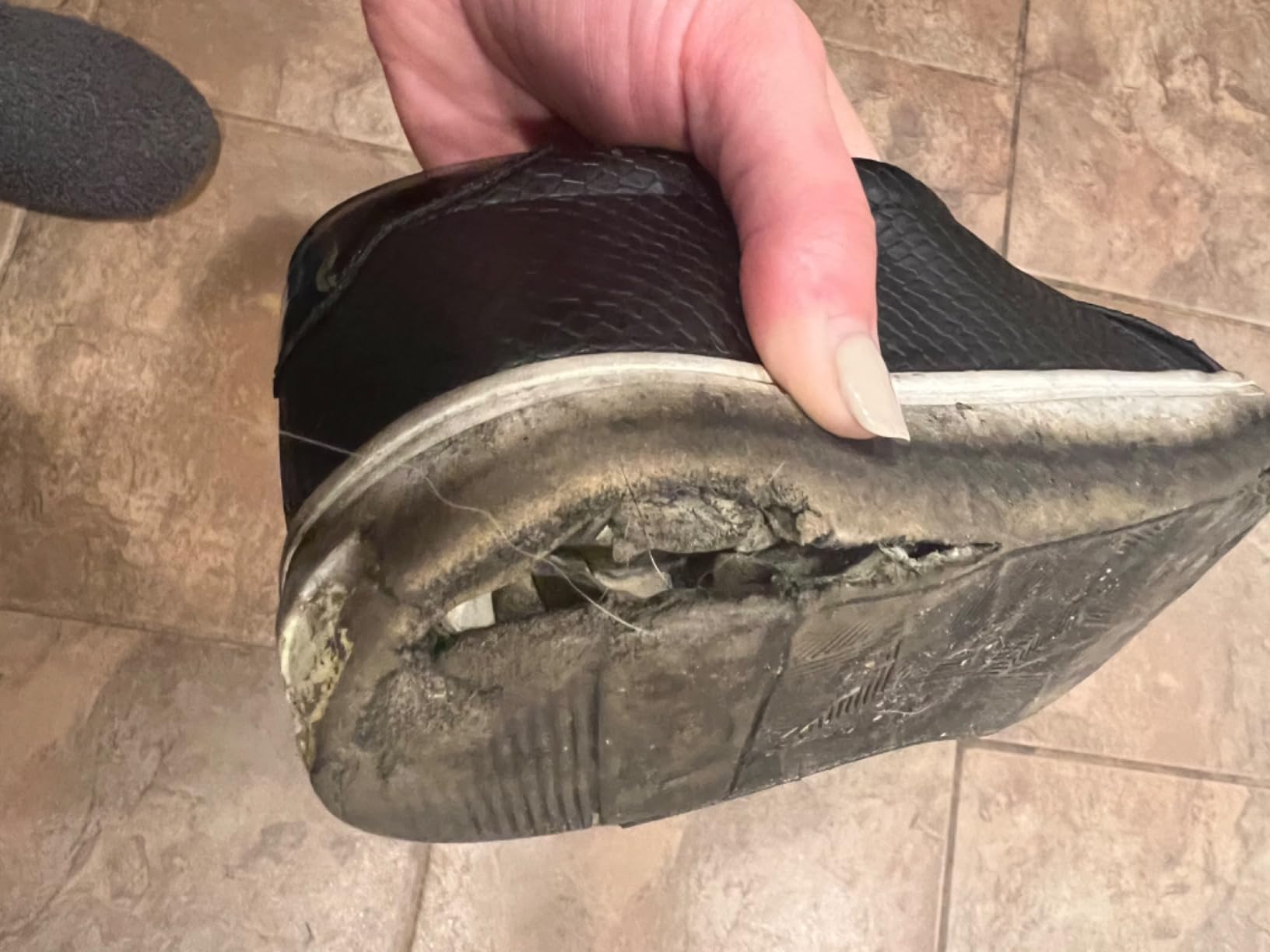 Dr. Scholl's Nova showing visible sole detachment and structural damage after approximately four months of regular wear