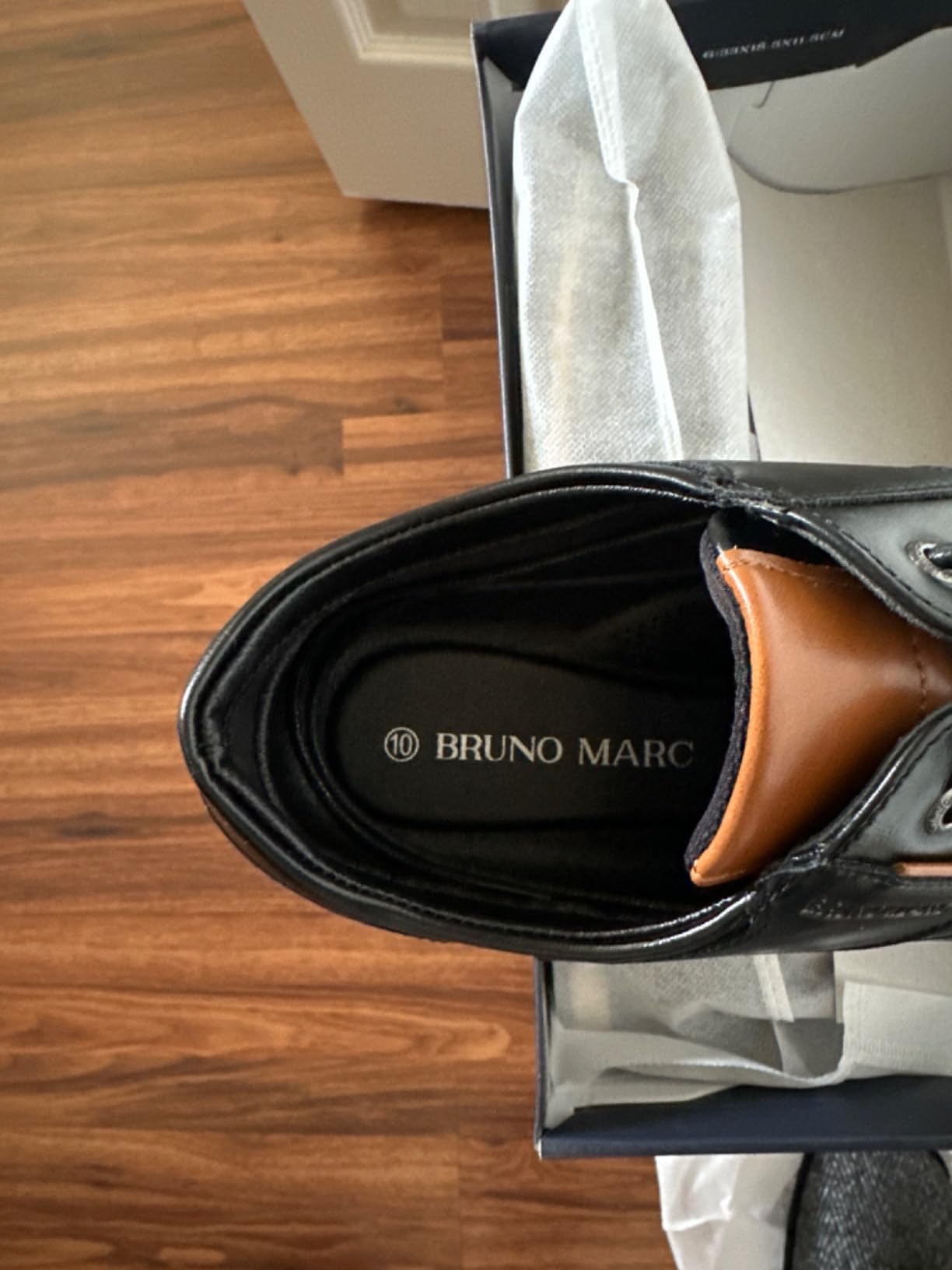 Top-down view of Bruno Marc dress shoes showing lace pattern and knit upper construction quality