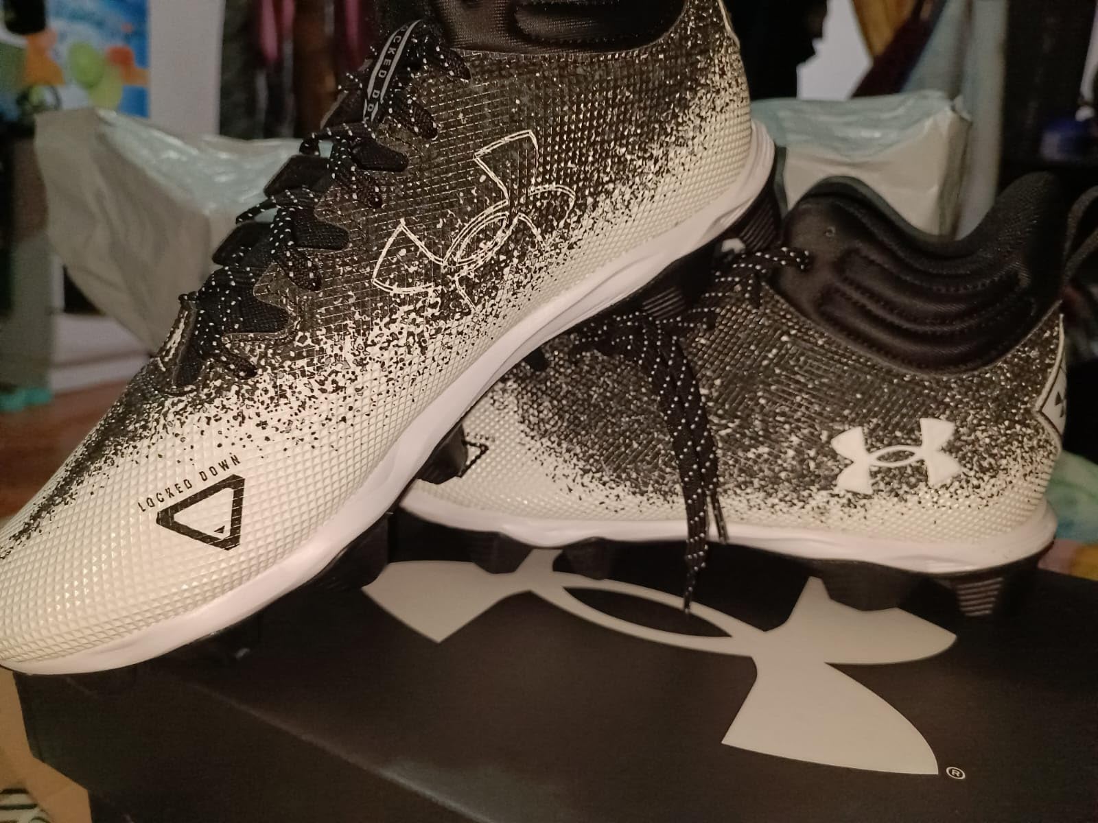 Close-up view of Under Armour Spotlight Fran 2.0 showing engineered synthetic upper construction and soft synthetic ankle collar detail