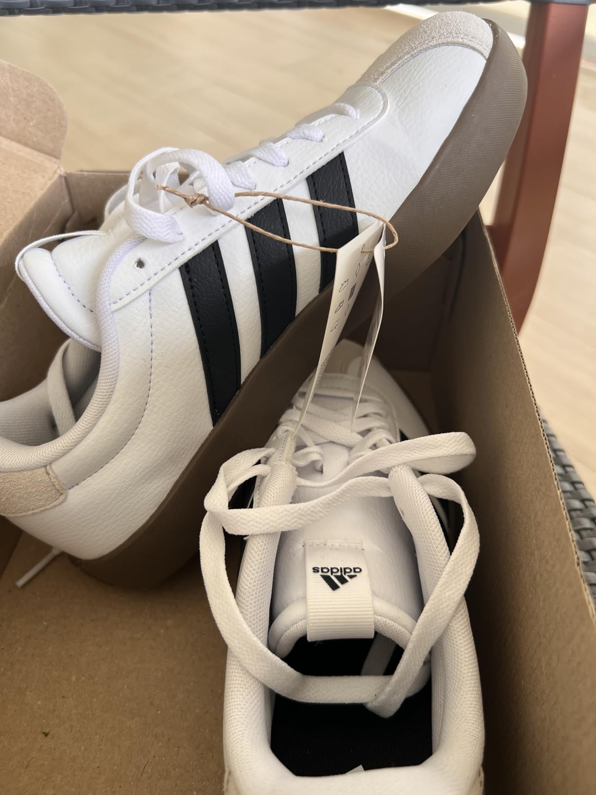 Close-up of Adidas VL Court 3.0 upper construction showing suede material quality and lacing system