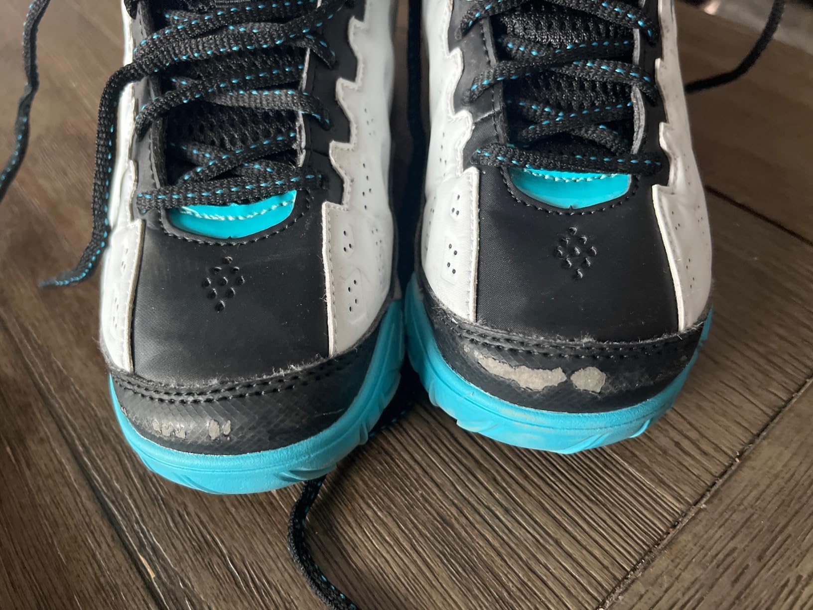 AND1 Showout youth basketball shoes showing visible toe wear and material stress marks after three weeks of regular use