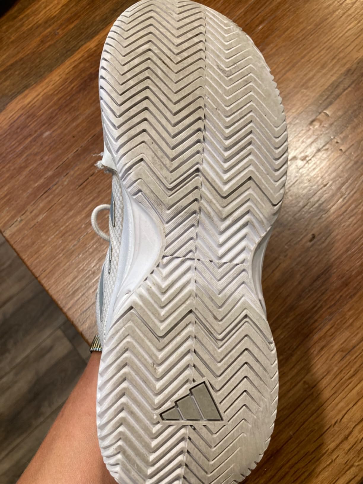 Side view of Adidas Gamecourt 2 showing seam separation at mesh and rubber overlay junction after extended use