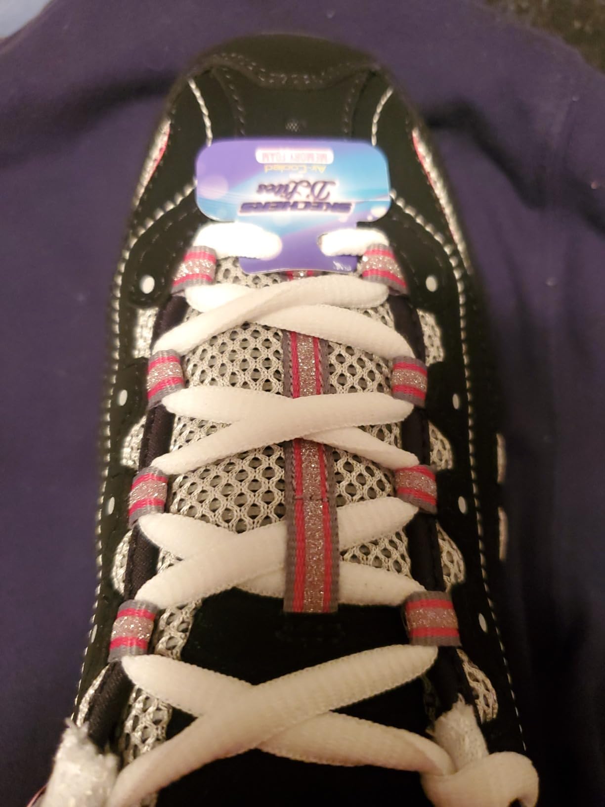 Close-up of the thick chunky rubber outsole of the Skechers D'Lites showing the tread pattern.