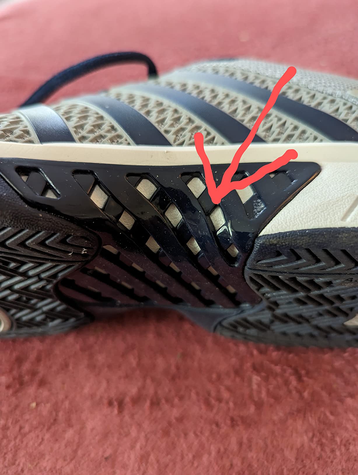 K-Swiss Express Light plastic webbing and potential wear stress points visible in construction detail