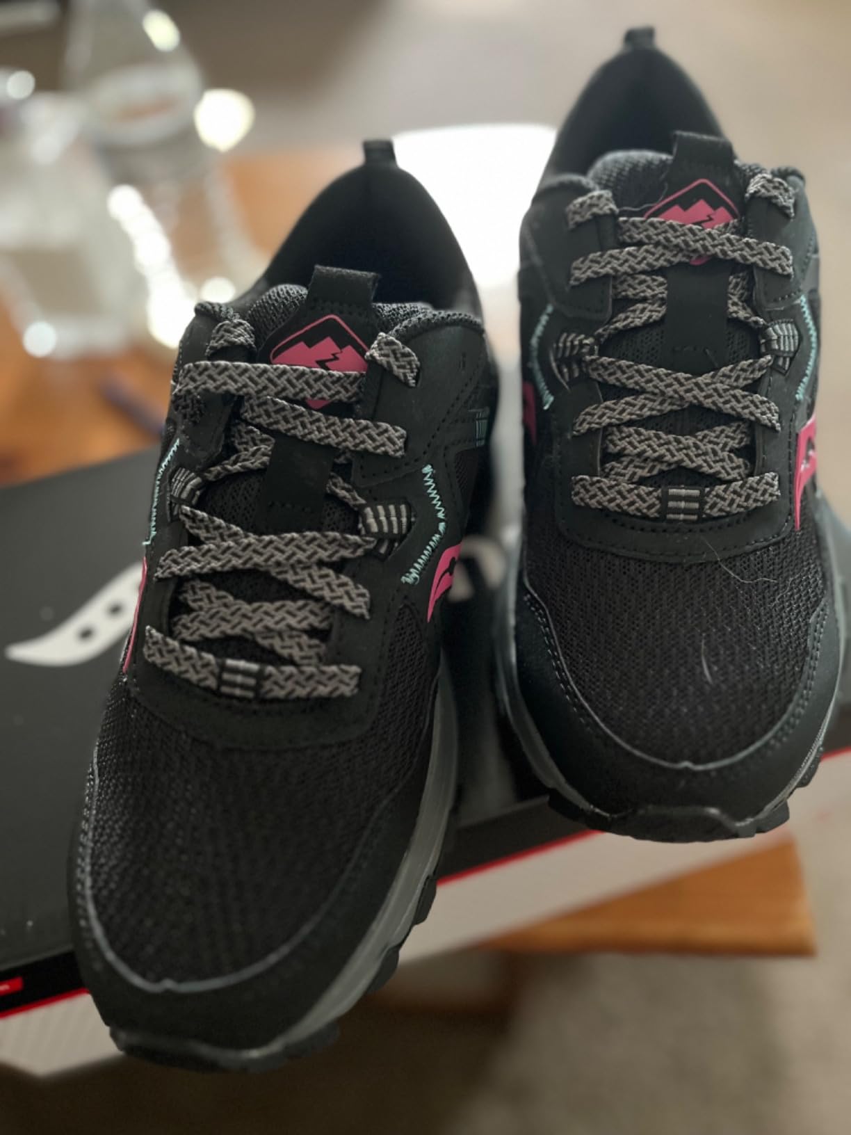 Saucony TR16 on trail showing varied terrain including wet surfaces