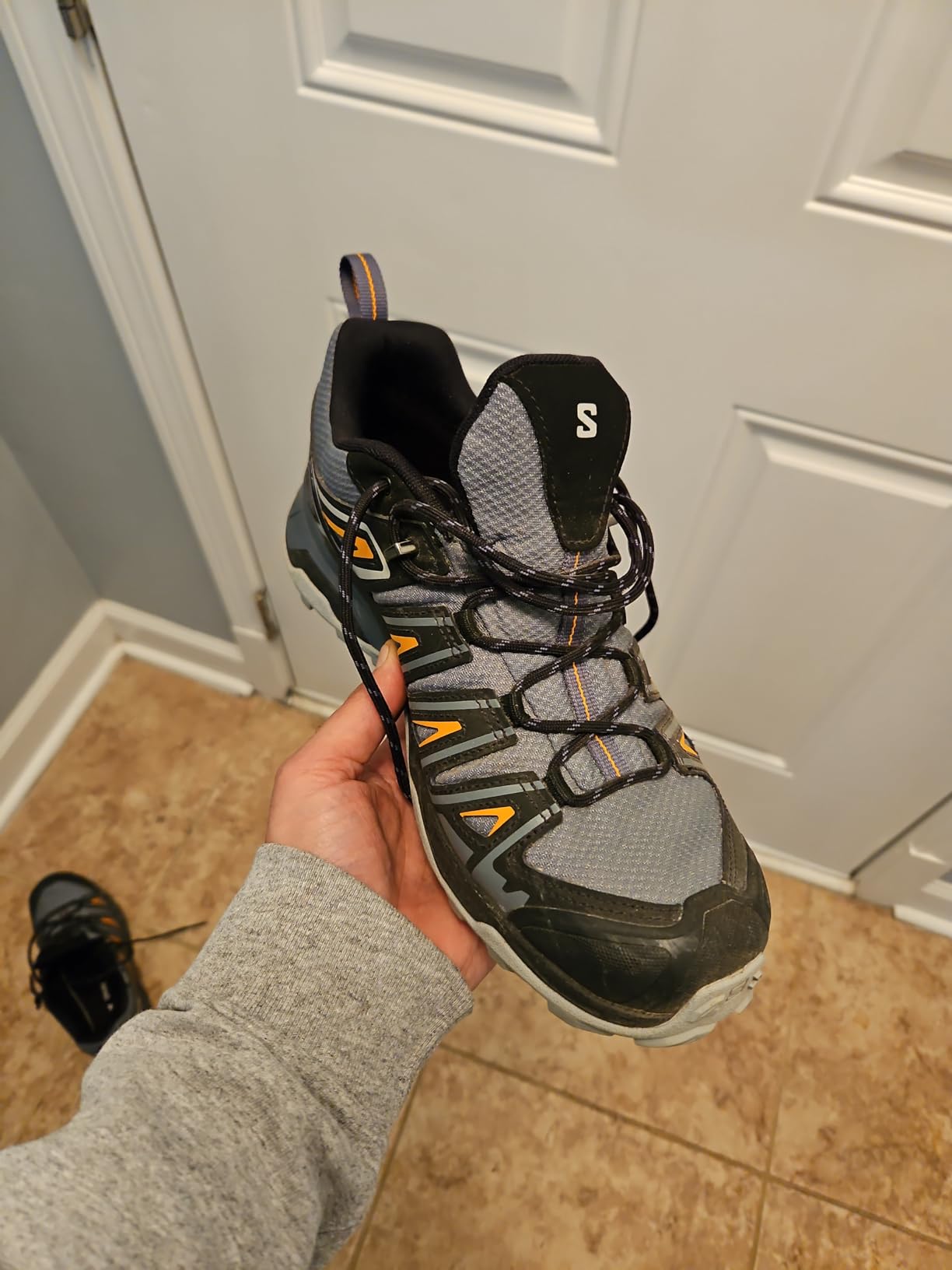 Salomon X Ultra Pioneer in wet creek crossing conditions showing ClimaSalomon waterproof membrane performance