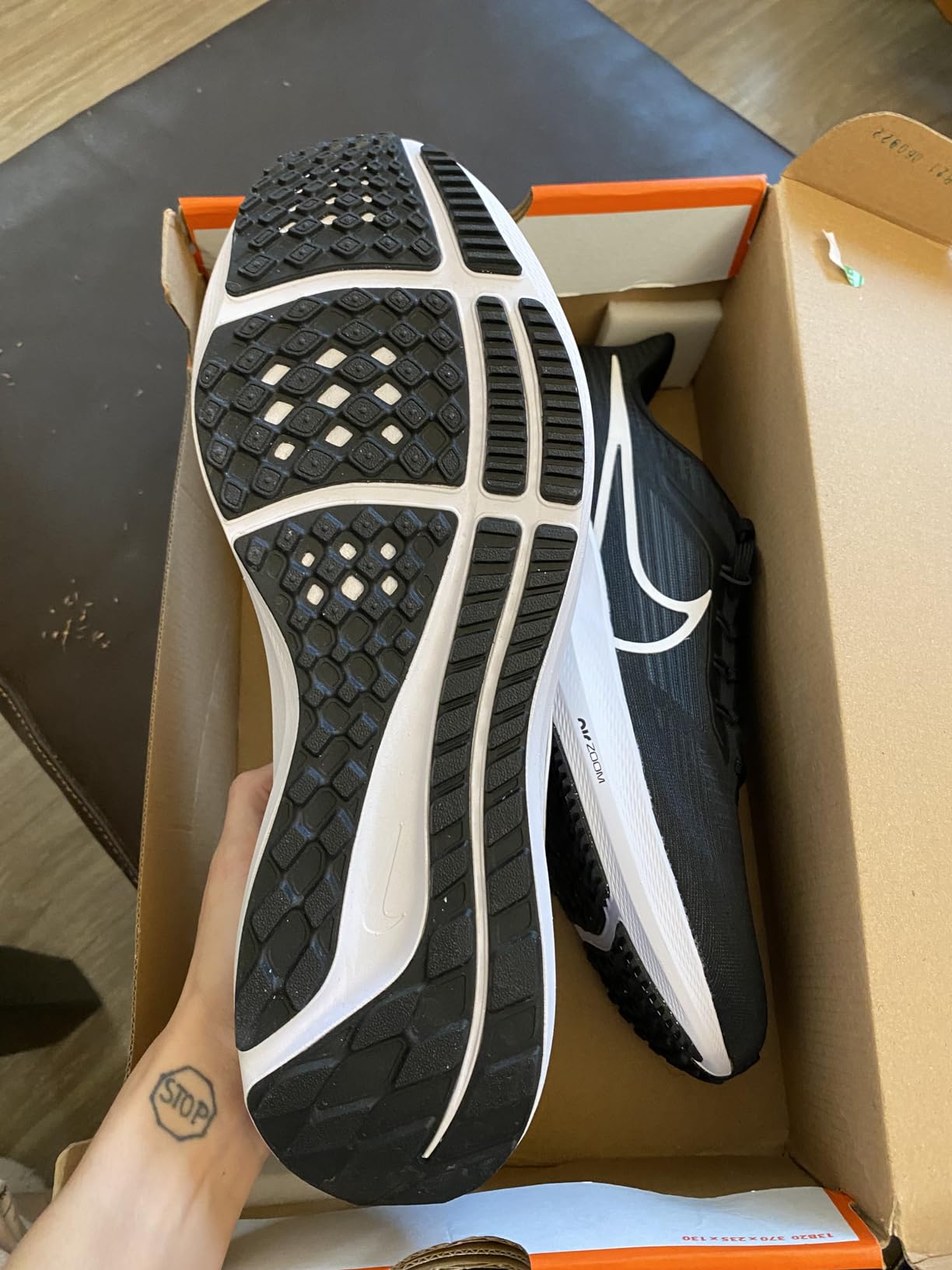 Nike Pegasus 39 outsole showing waffle traction pattern and carbon rubber compound