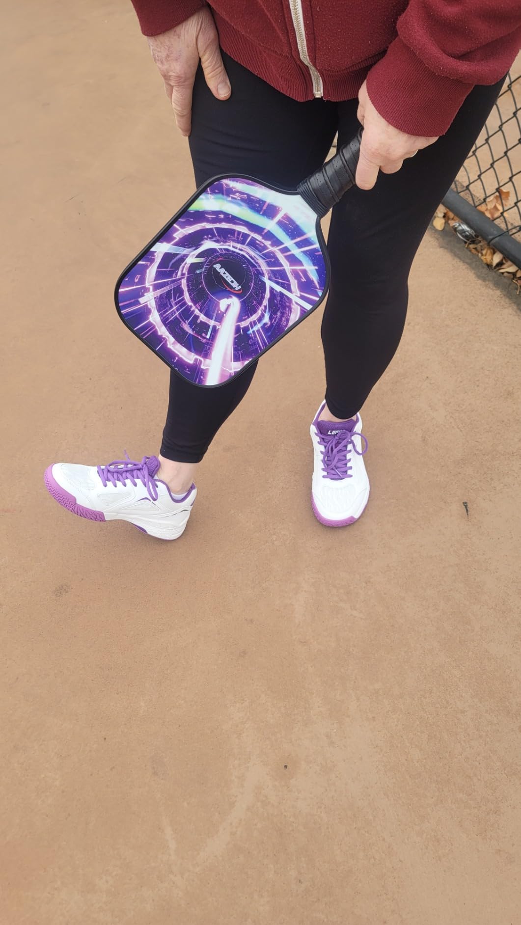 LEFUS P601 action shot showing court performance during play with purple color highlights