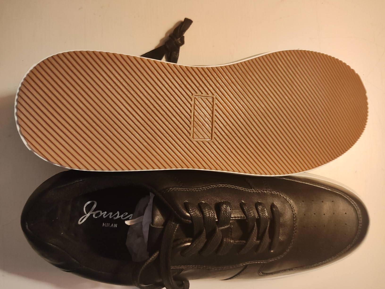 Detailed close-up of Jousen sneaker TPR rubber sole showing tread pattern and construction for traction on various surfaces