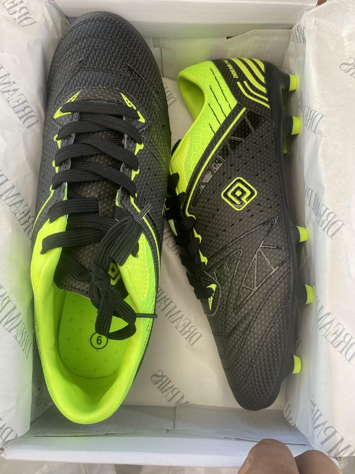DREAM PAIRS soccer cleats detailed view showing faux leather upper construction and lace system
