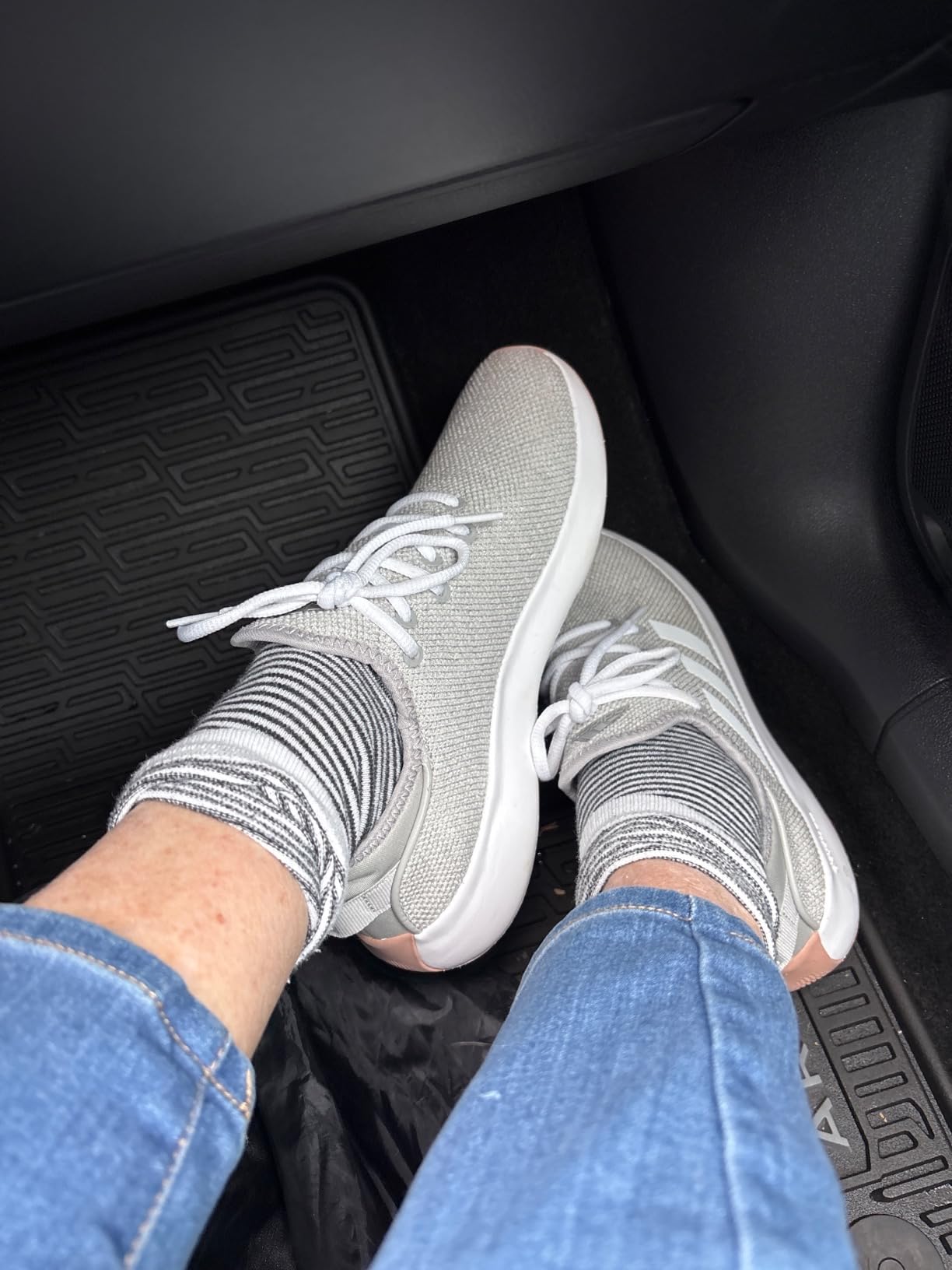 Side profile view of Adidas Cloudfoam Pure showing low heel tab placement and slip-on opening construction