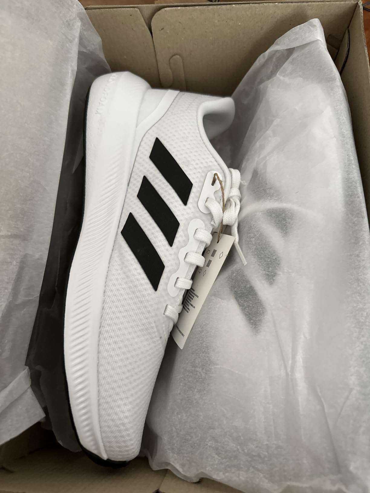 Side profile of Adidas Run Falcon 3.0 highlighting Cloudfoam midsole technology and overall shoe construction