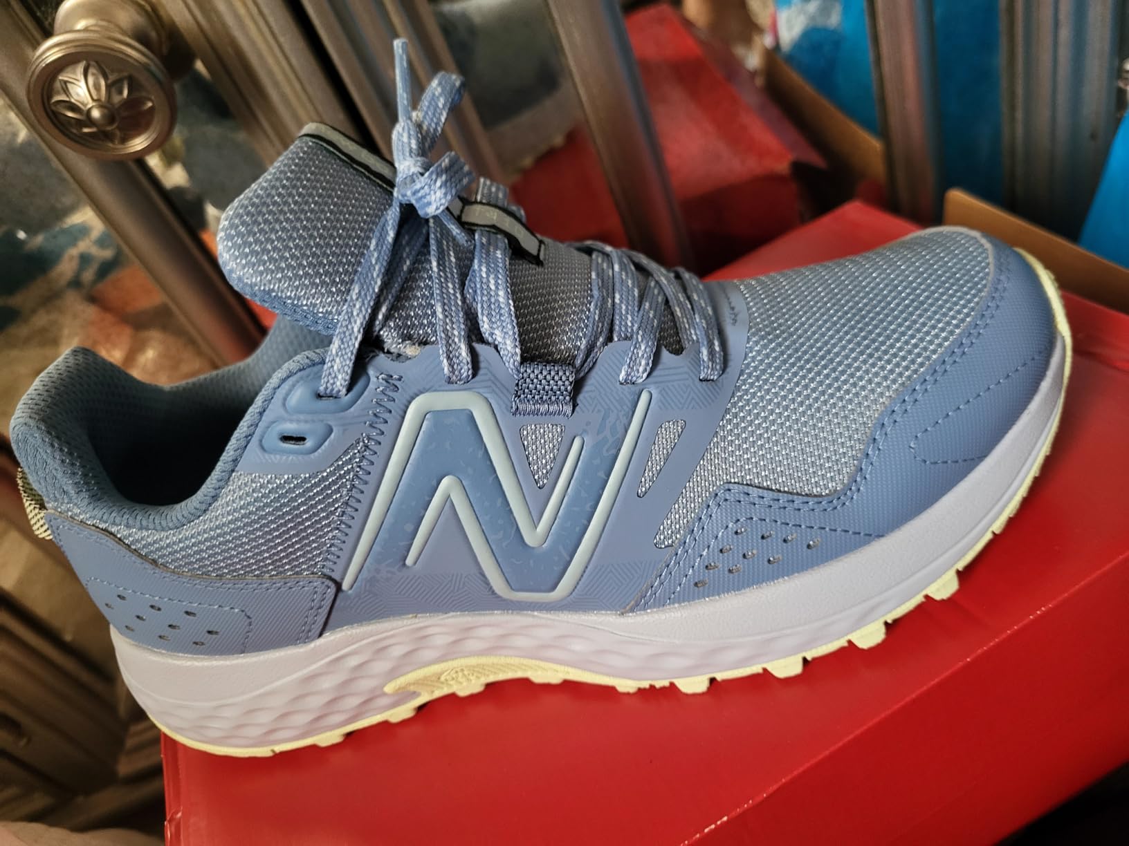 New Balance 410 V8 worn during active use showing real-world trail and urban versatility