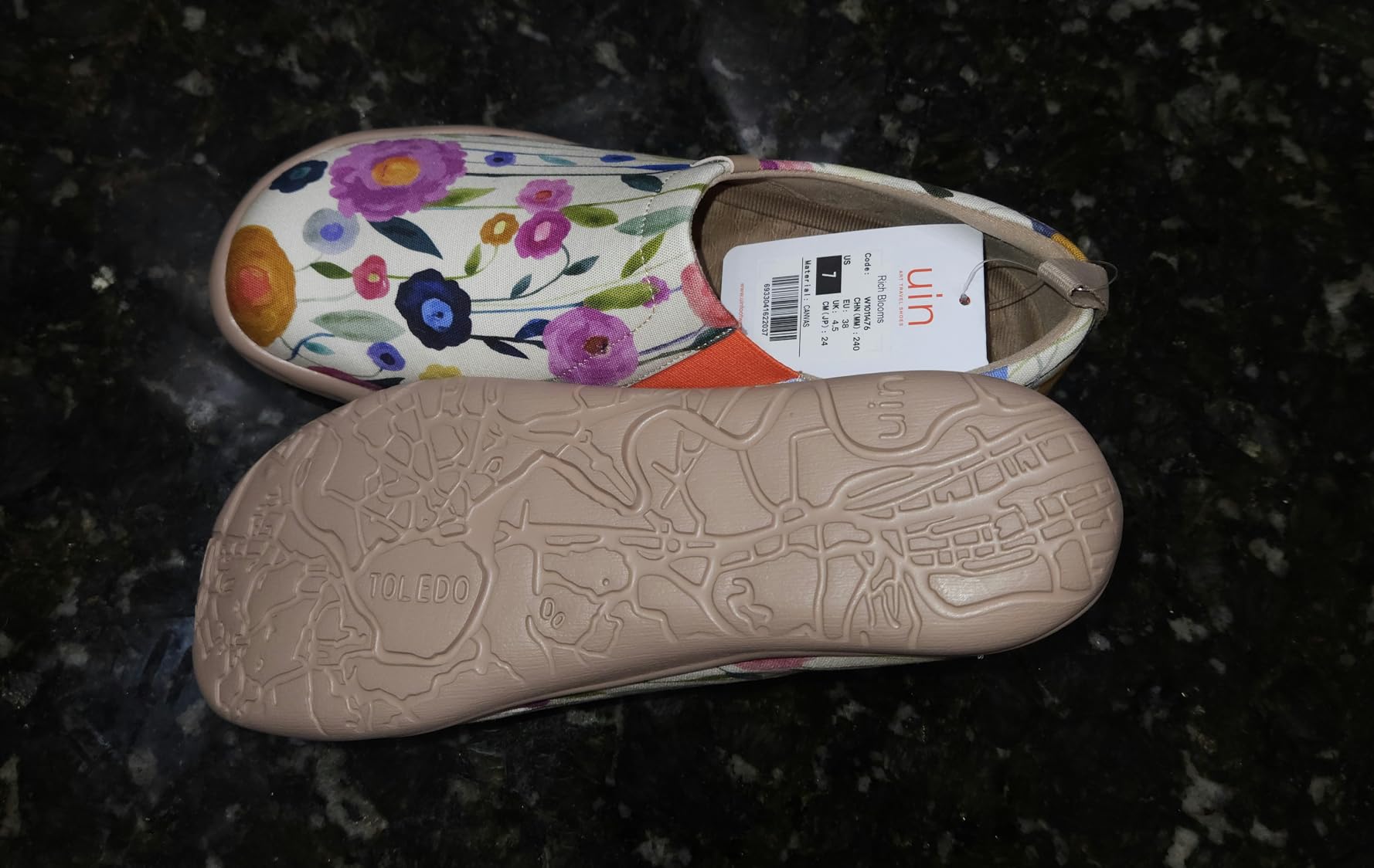 UIN Blossom shoes showing orange elastic side panel and slip-on design with roomy toe box construction
