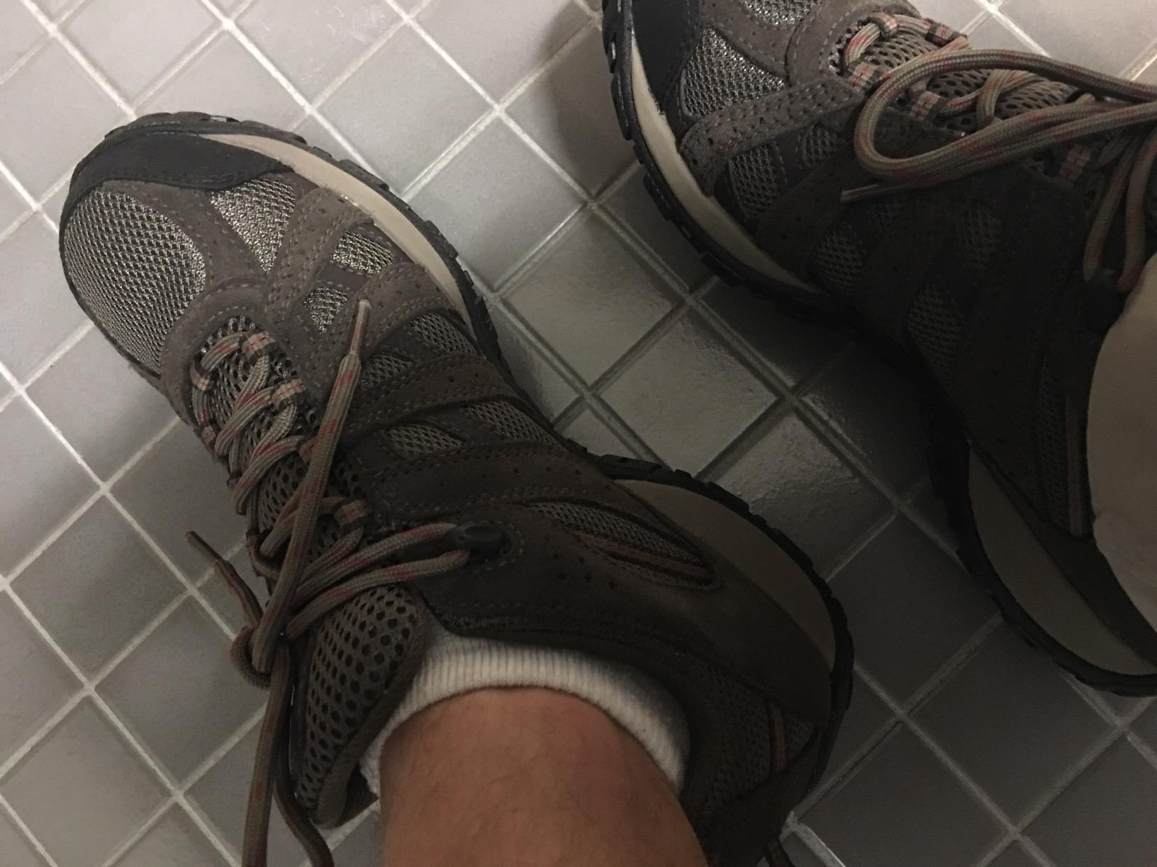 Columbia Redmond hiking shoes on challenging terrain showing real-world durability and performance in difficult conditions