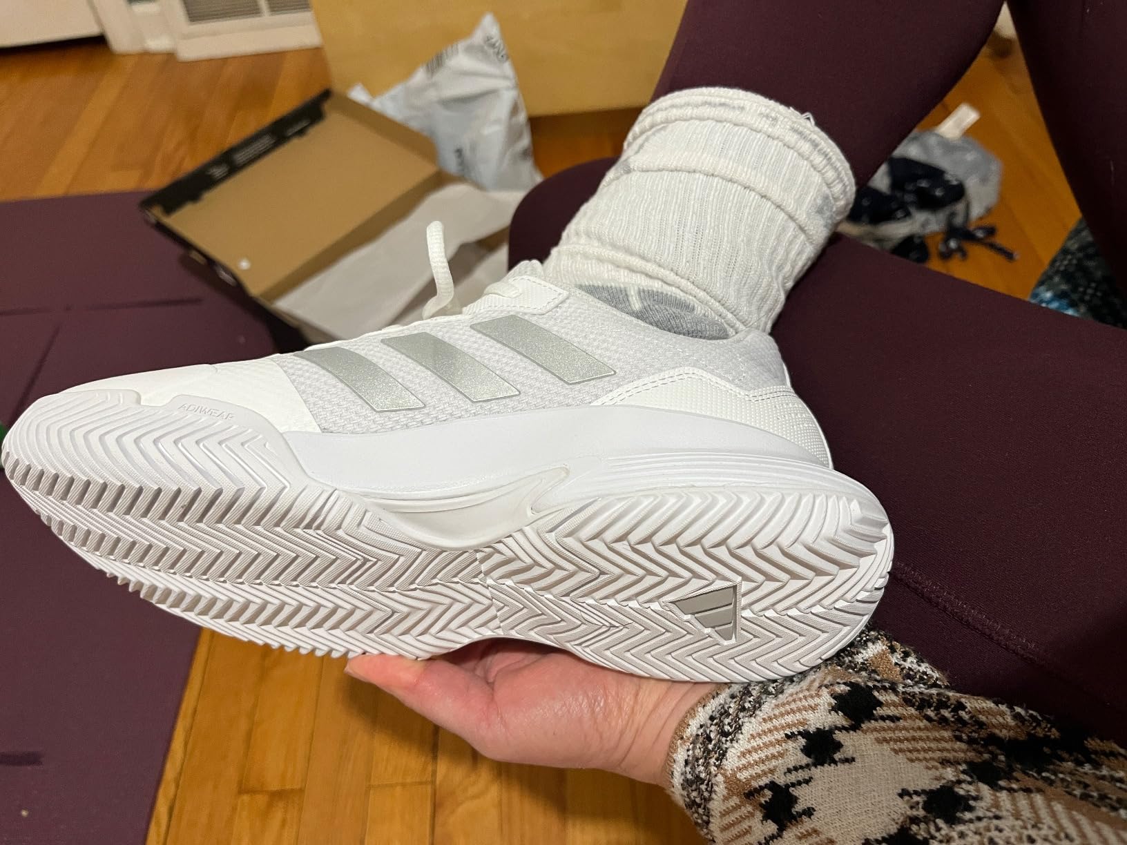 Multiple angles of Adidas Women's Gamecourt 2 showing court shoe design details and construction