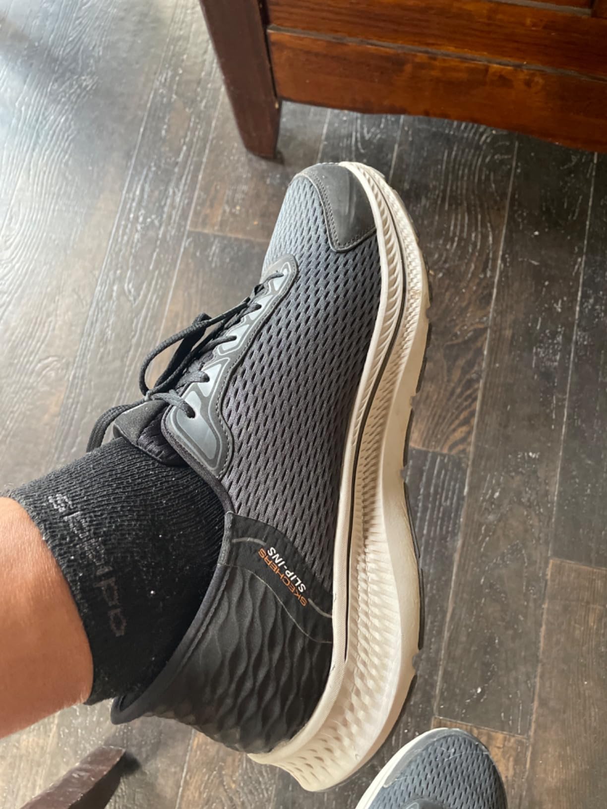 Skechers Men's Go Run Consistent 2.0 Empowered lifestyle shot showing versatility for daily activities
