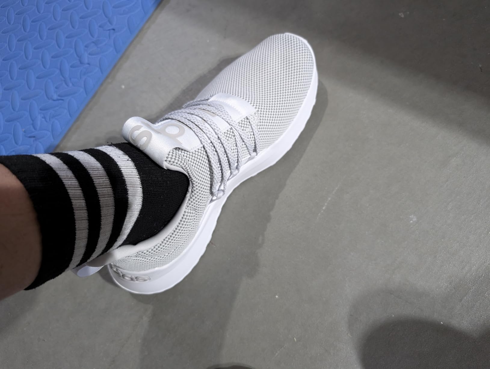 Adidas Men's Lite Racer Adapt 5.0 slip-on shoes showing Cloudfoam midsole and stretchy textile upper