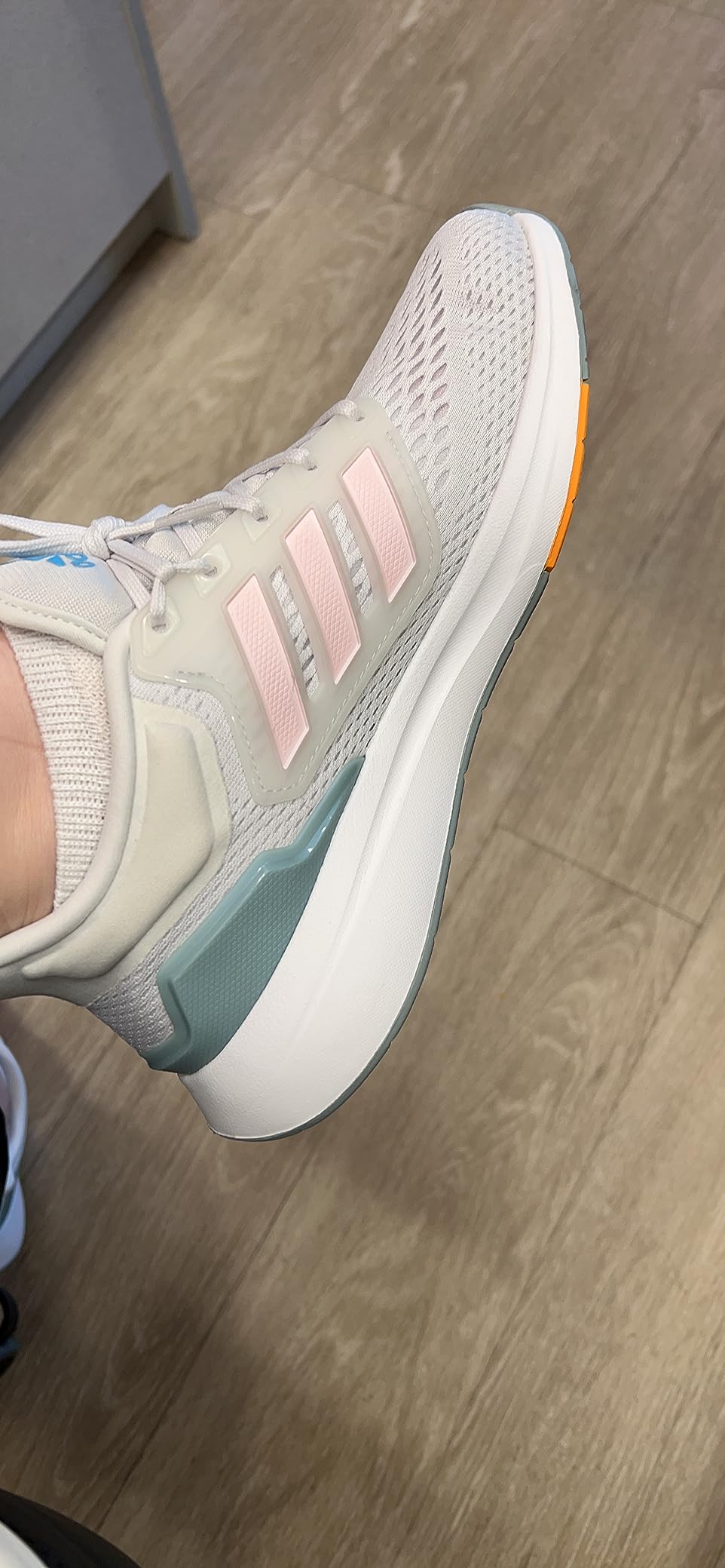 adidas Women's Eq21 Run shoes in blue and pink colorway showing Bounce midsole and engineered mesh upper design