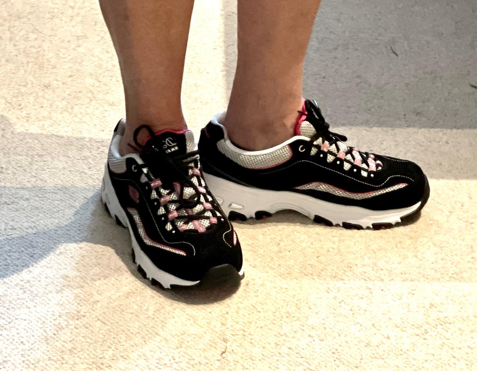 Woman wearing Skechers D'Lites showing how they integrate into a casual everyday outfit.
