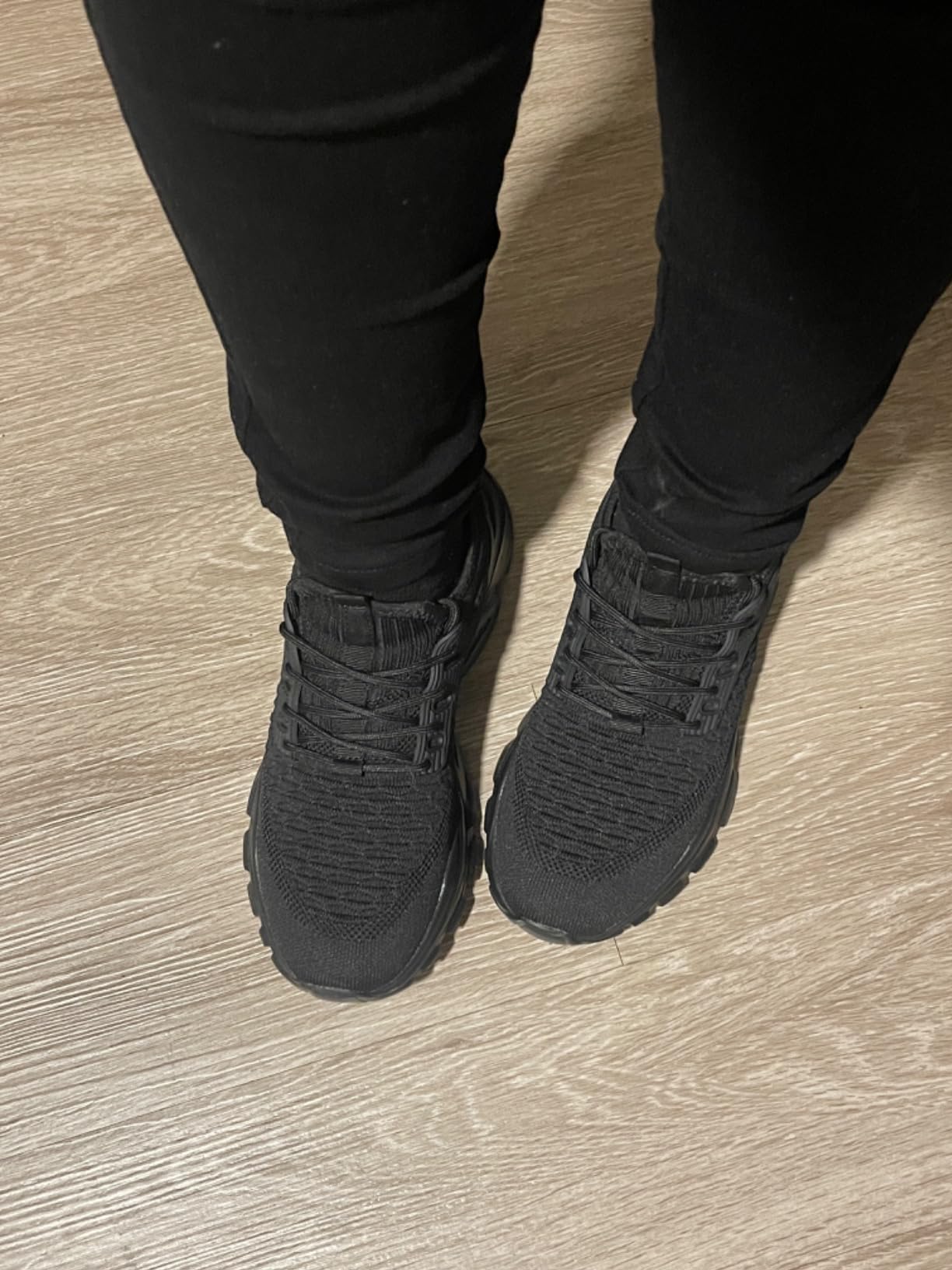 Full outfit shot showing KEEZMZ Women's Slip-On Sneakers styled with casual jeans and athletic wear