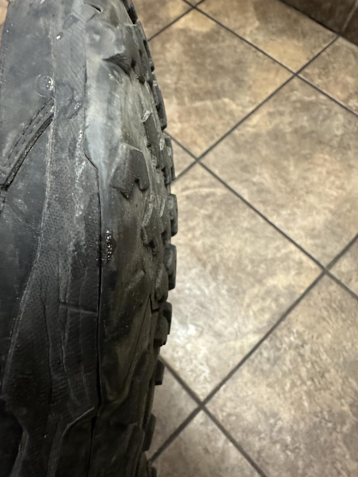Bottom view of Adidas Terrex AX4 showing Continental rubber tread wear pattern after 180+ miles