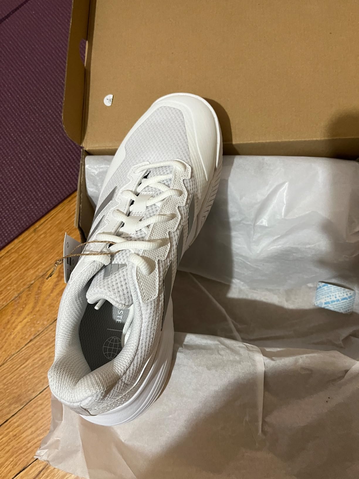Final product shot of Adidas Women's Gamecourt 2 showing complete court shoe design in white silver colorway