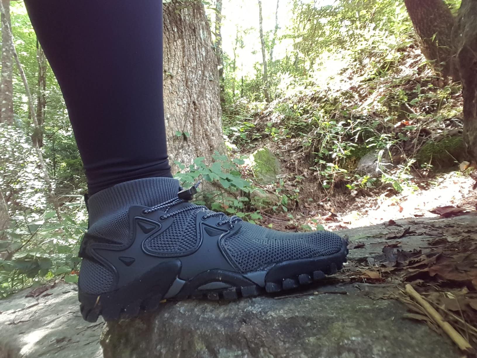 Side view of hiking shoes showing ankle collar protection height and sole construction detail