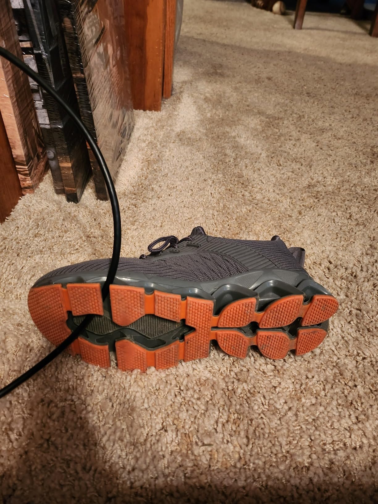 Bottom view of Srenket blade sneakers revealing the controversial lattice sole pattern with gaps and rigid plastic blades