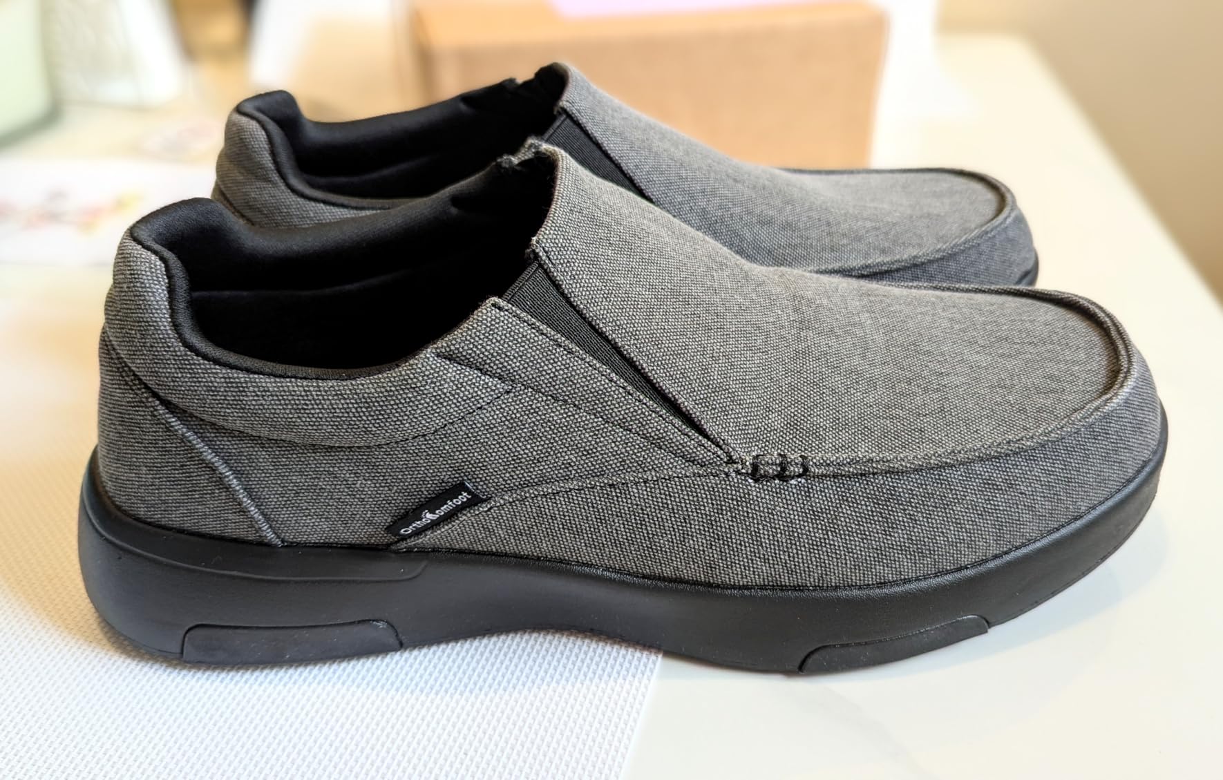 Side comparison of OrthoComfoot high-arch and low-arch insole sets showing different support heights