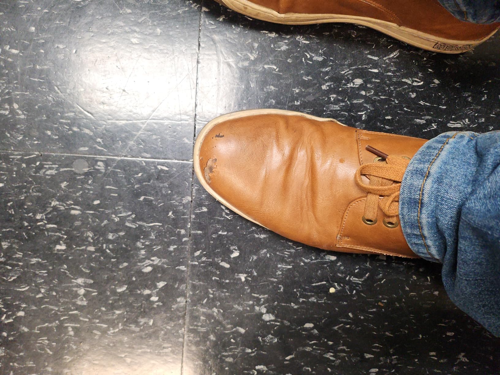 Jousen dress sneaker showing visible signs of wear with sole separation beginning after several months of regular use