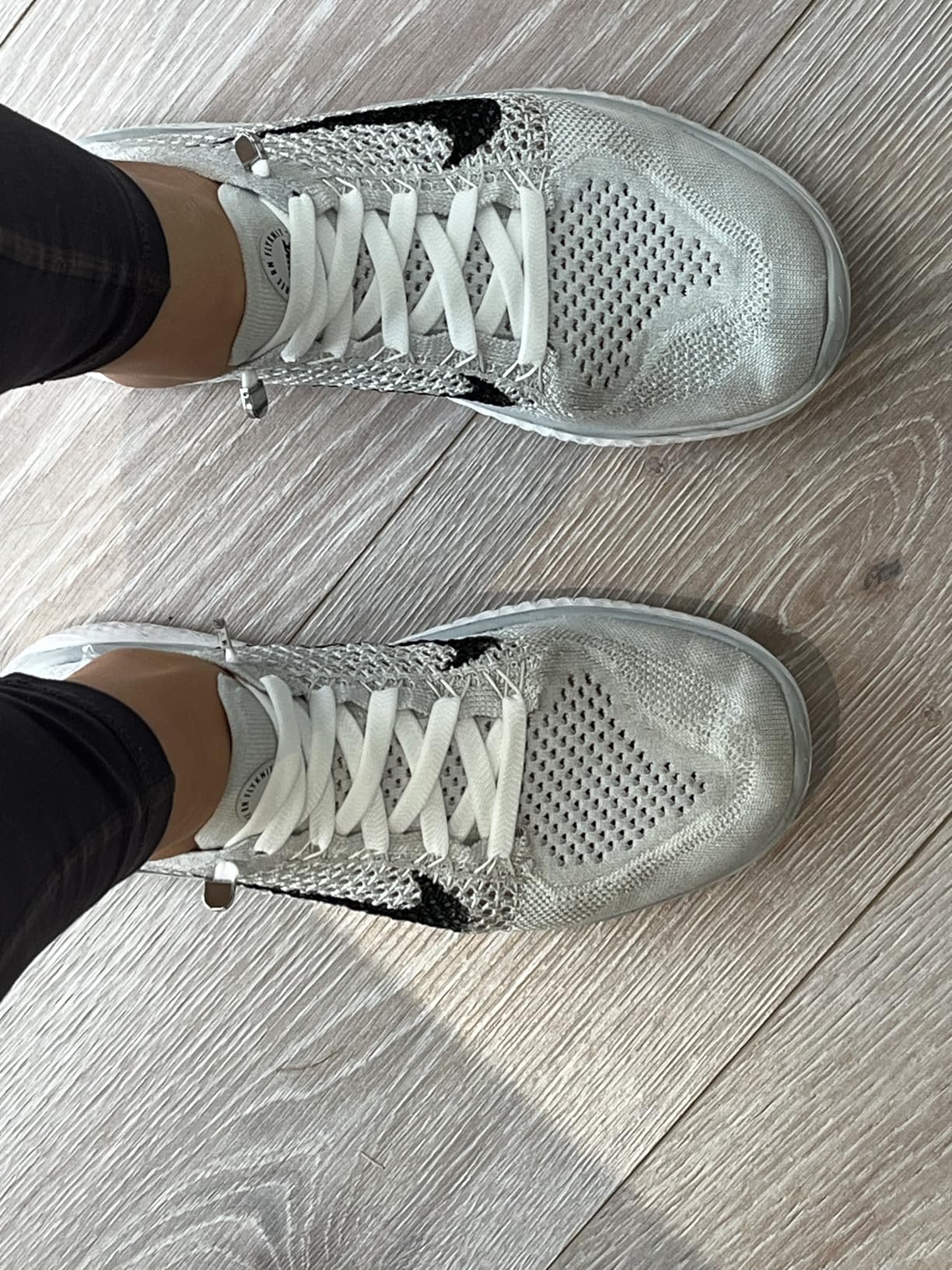 Final assessment showing Hstgaga elastic shoelaces installed across multiple family shoes demonstrating versatility