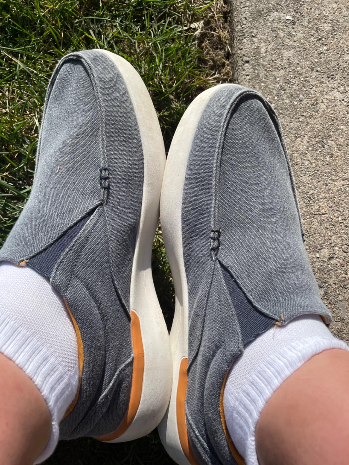OrthoComfoot orthopedic slip-on shoes worn in real-world daily setting showing denim canvas aesthetic