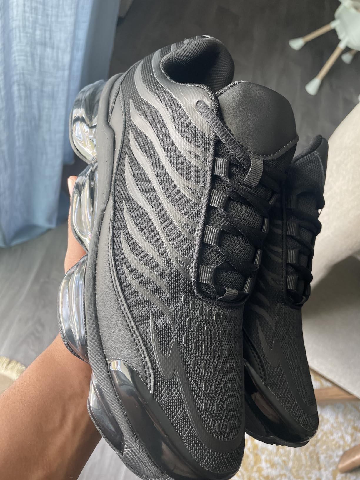 Close-up detail of mesh upper construction and synthetic overlays on Men's Air Running Shoes