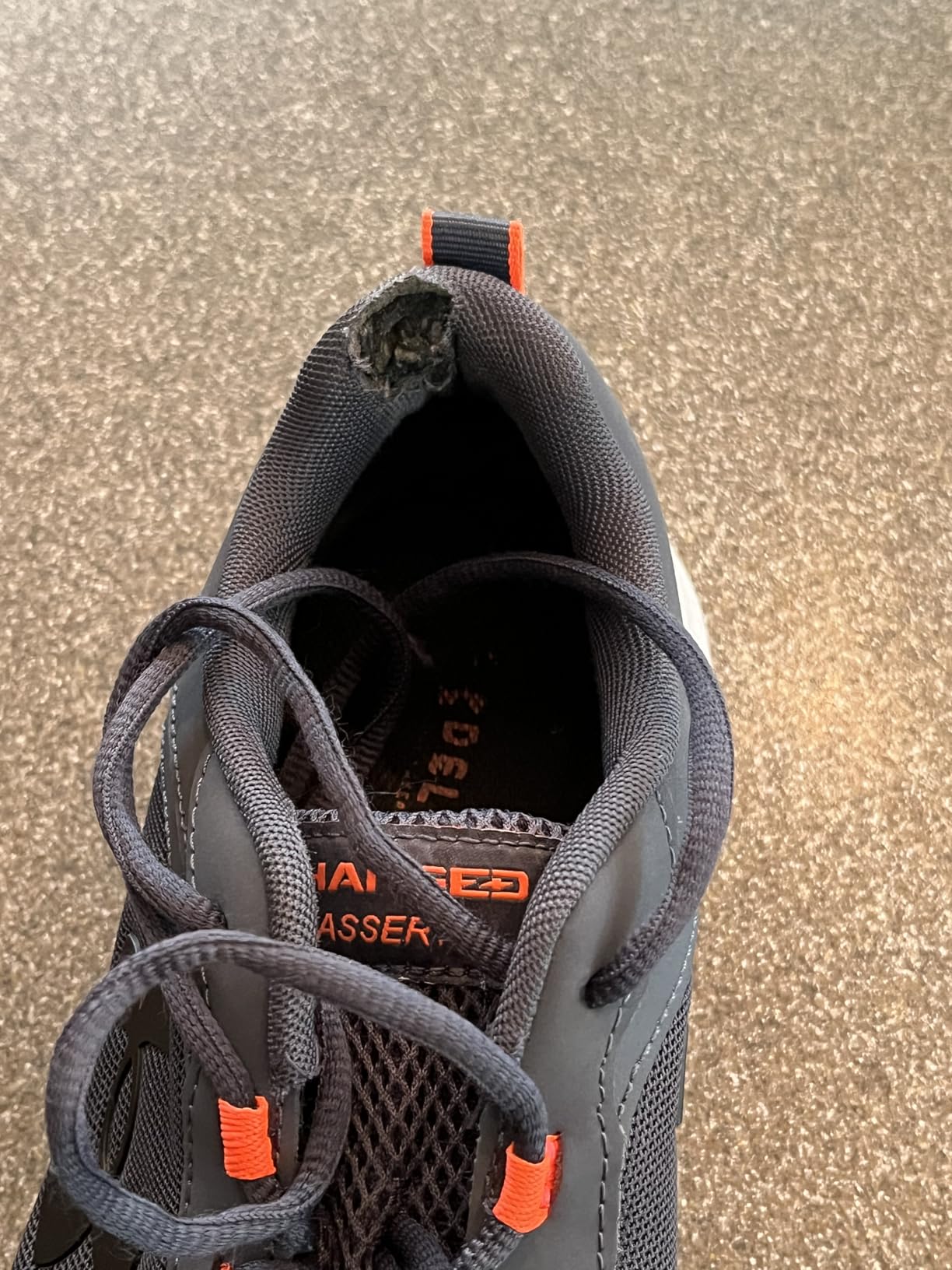 Under Armour Charged Assert 9 outsole pattern detail showing solid rubber coverage across high-impact zones and durable traction design