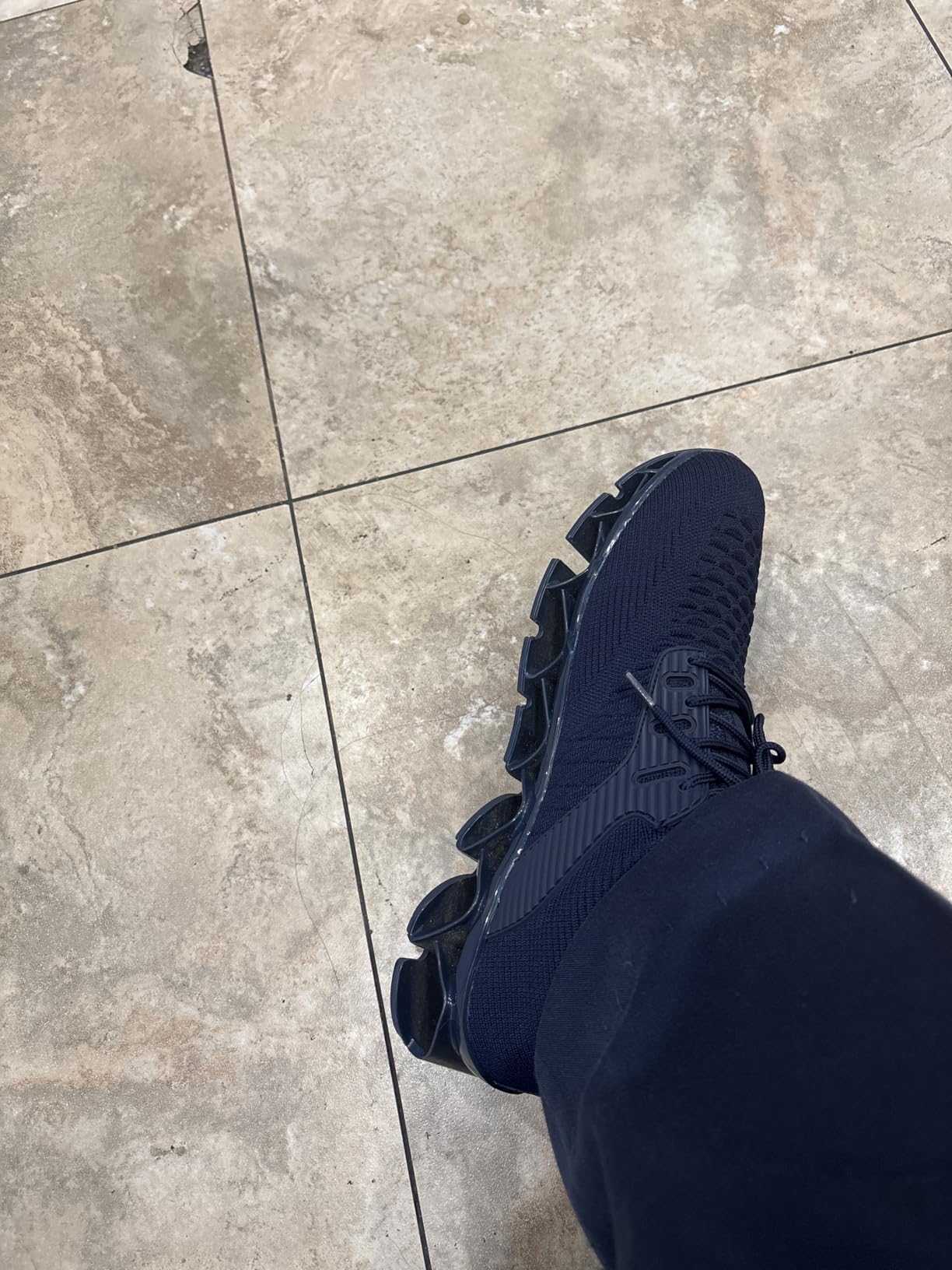 Close-up view of Kvovzo blade shoes showing navy colorway and knit upper construction details