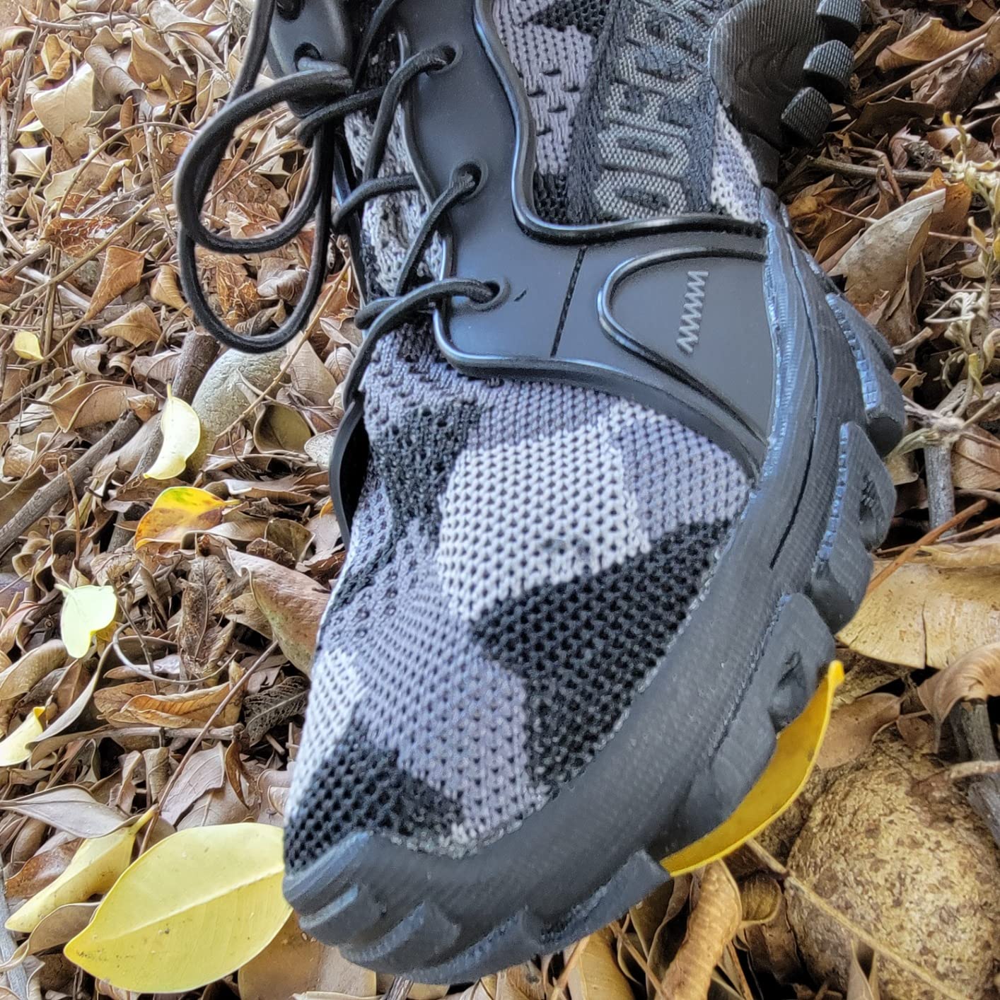 TANGYUGEN water shoes army green colorway showing knit mesh upper and rubber sole on outdoor surface