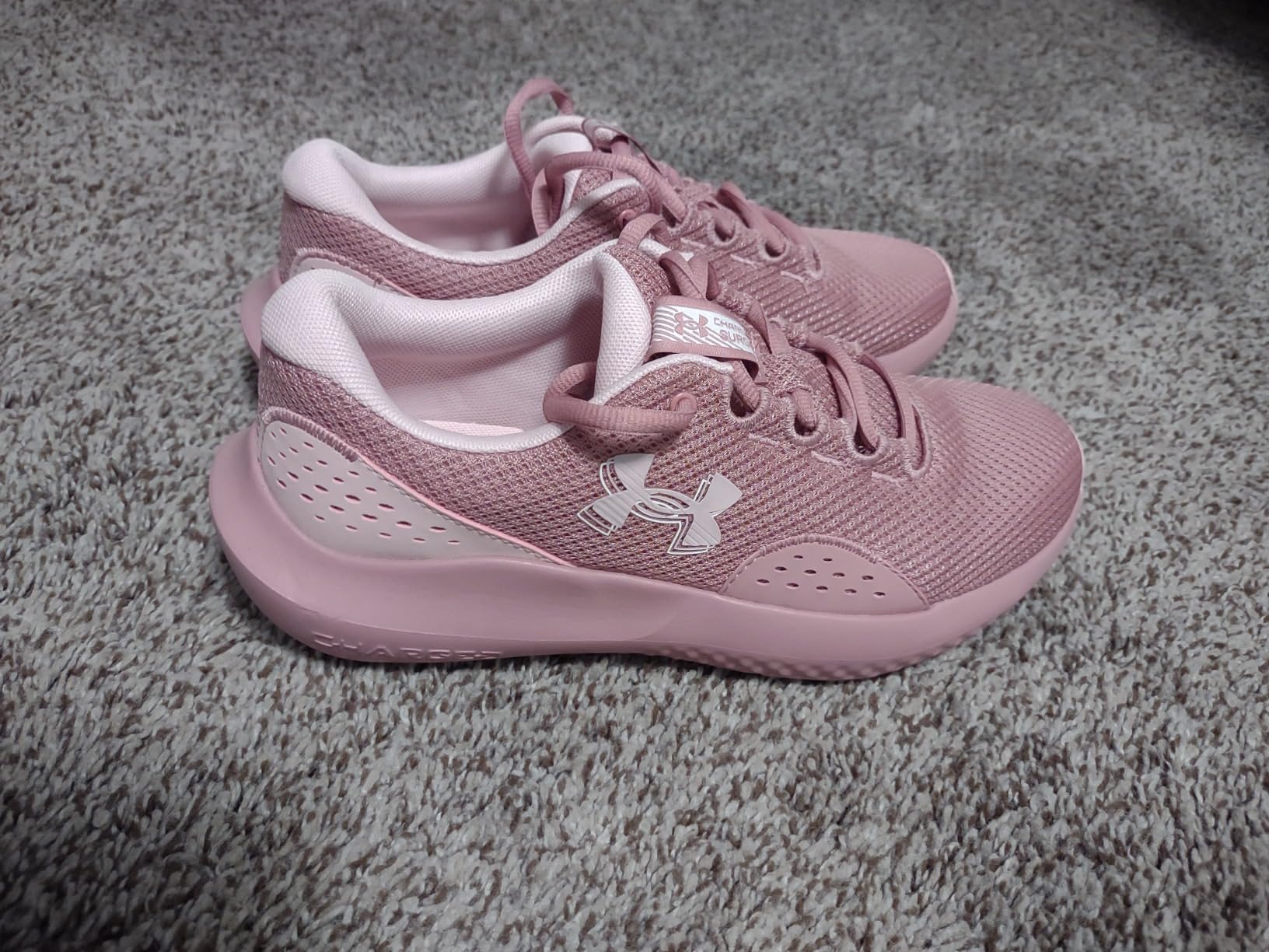 Under Armour Women's Charged Surge 4 lifestyle shot showing gym and casual wear versatility for active daily lifestyle