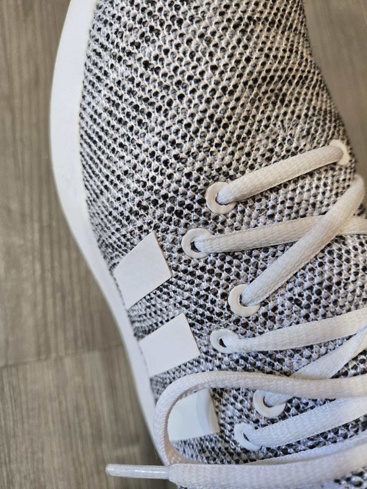 Close-up of Adidas Cloudfoam Pure mesh upper showing breathable construction and elastic lacing detail