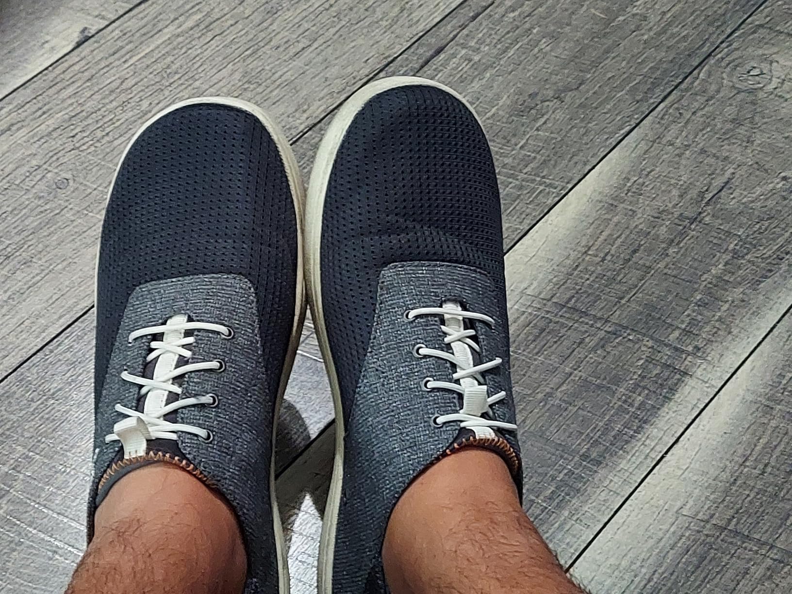 Close-up of OLUKAI Nohea Moku breathable mesh upper construction and fold-down heel drop-in design