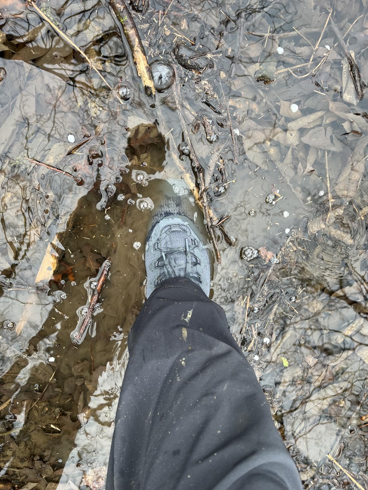Columbia Facet 75 waterproof testing showing shoe in deep water puddle demonstrating OUTDRY technology