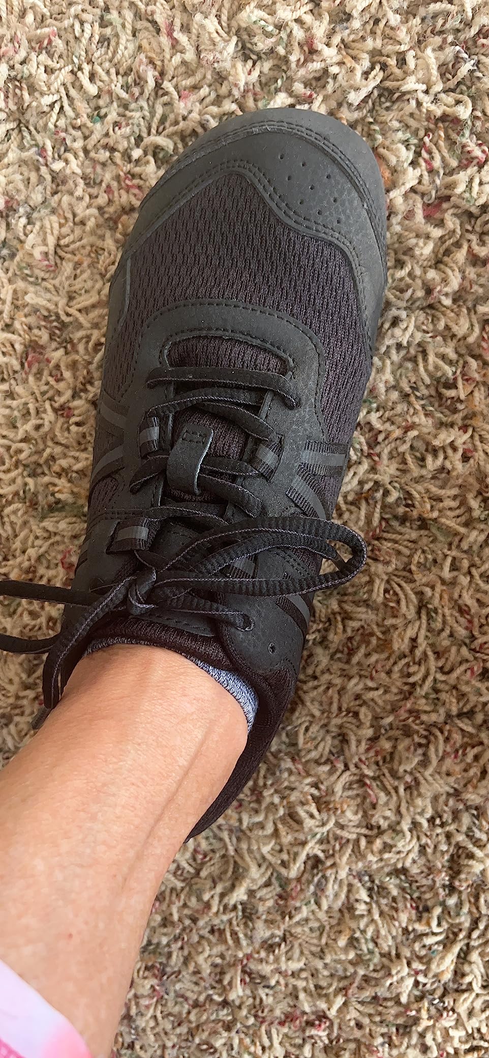 Xero Shoes Women's Prio barefoot athletic sneakers showing wide foot-shaped toe box design in black and white colorway