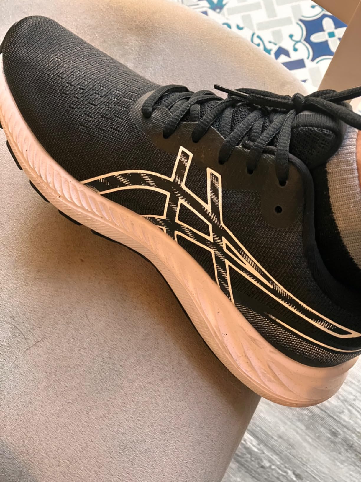 ASICS Women's Gel-Excite 9 running shoes in Barely Rose White colorway showing mesh upper and overall silhouette
