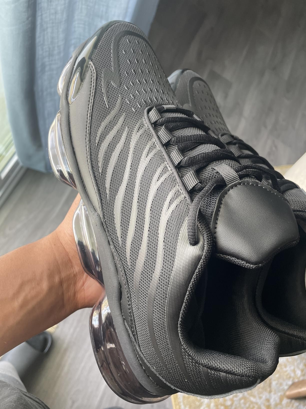 Side profile showing air cushion technology and midsole construction of Men's Air Running Shoes